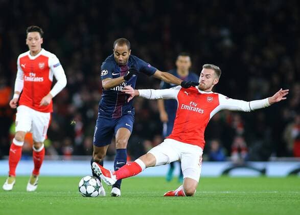 23.11.2016. Emirates Stadium, London, England. UEFA Champions League Football. Arsenal versus Paris Saint Germain. Arsenal Midfielder Aaron Ramsey wins the ball from Paris Saint-Germain Midfielder Lucas with a sliding tackle xMarkxKertonx  ActionPlus11813078