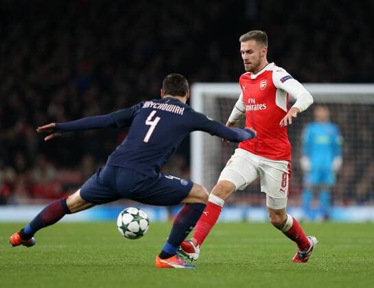 Arsenal s Aaron Ramsey tussles with PSG s Gregorz Krychowiak during the Champions League group A match at the Emirates Stadium, London. Picture date November 23rd, 2016 Pic David Klein Sportimage EDITORIAL USE ONLY. No use with unauthorised audio, video, data, fixture lists, club league logos or live services. Online in-match use limited to 120 images, no video emulation. No use in betting, games or single club league player publications.