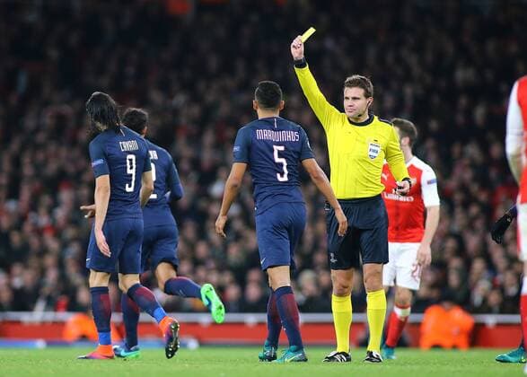 23.11.2016. Emirates Stadium, London, England. UEFA Champions League Football. Arsenal versus Paris Saint Germain. Paris Saint-Germain Defender Marquinhos receives a yellow card from Referee Felix Byrch for a rough challenge on Arsenal Forward Alexis S& xe1;nchez xMarkxKertonx  ActionPlus11813099