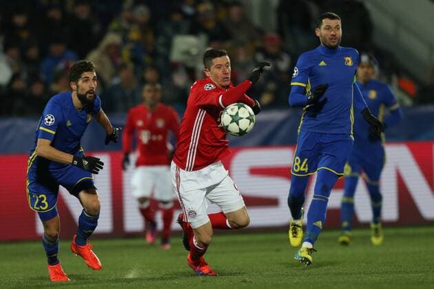November 23, 2016 - Rostov-On-Don, Russia - Miha Mevlja (L) of FC Rostov and Robert Lewandowski (C) of FC Bayern Munich vie for the ball during the UEFA Champions League Group D football match between FC Bayern Munich and FC Rostov, at Olimp 2 Stadium in Rostov-on-Don, Russia on Novemberr 23, 2016. FC Rostov v FC Bayern Muenchen - UEFA Champions League  - ZUMAn230 20161123_zaa_n230_160