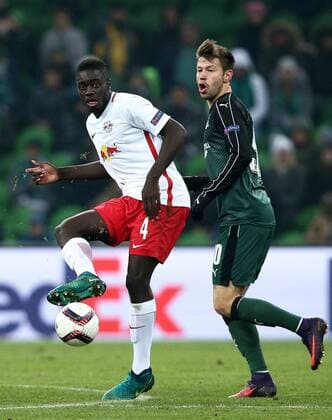 KRASNODAR, RUSSIA - NOVEMBER 24, 2016: Red Bull Salzburg s Dayotchanculle Dayot Upamecano (L) and FC Krasnodar s Fyodor Smolov fight for the ball in their 2016-17 Season UEFA Europa League Group I football match at the Krasnodar Stadium. The game ended in a 1-1 draw. Vitaly Timkiv TASS  TS038C2A
