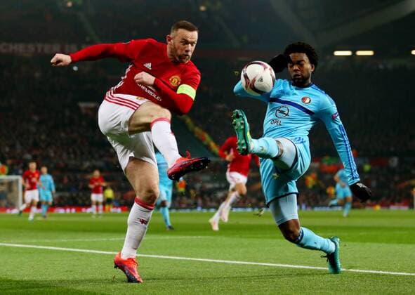 Wayne Rooney of Manchester United ManU takes on Miguel Nelom of Feyenoord during the UEFA Europa League match at Old Trafford, Manchester. Picture date: November 24th 2016. Pic Matt McNulty Sportimage EDITORIAL USE ONLY. No use with unauthorised audio, video, data, fixture lists, club league logos or live services. Online in-match use limited to 120 images, no video emulation. No use in betting, games or single club league player publications.