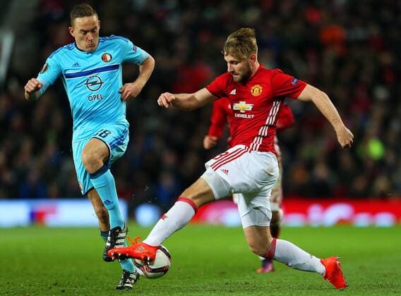 Luke Shaw of Manchester United ManU takes on Jens Toornstra of Feyenoord during the UEFA Europa League match at Old Trafford, Manchester. Picture date: November 24th 2016. Pic Matt McNulty Sportimage EDITORIAL USE ONLY. No use with unauthorised audio, video, data, fixture lists, club league logos or live services. Online in-match use limited to 120 images, no video emulation. No use in betting, games or single club league player publications.