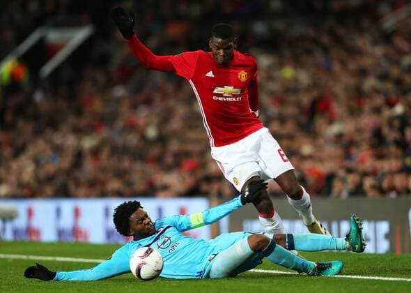 Paul Pogba of Manchester United ManU takes on Miguel Nelom of Feyenoord during the UEFA Europa League match at Old Trafford, Manchester. Picture date: November 24th 2016. Pic Matt McNulty Sportimage EDITORIAL USE ONLY. No use with unauthorised audio, video, data, fixture lists, club league logos or live services. Online in-match use limited to 120 images, no video emulation. No use in betting, games or single club league player publications.