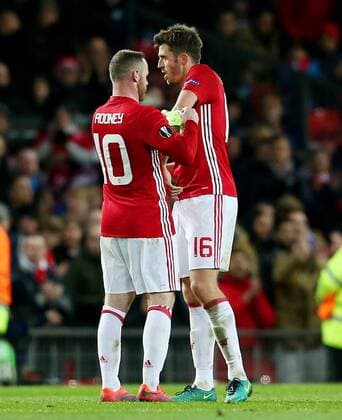 Wayne Rooney of Manchester United ManU hands the captains armband to team mate Michael Carrick during the UEFA Europa League match at Old Trafford, Manchester. Picture date: November 24th 2016. Pic Matt McNulty Sportimage EDITORIAL USE ONLY. No use with unauthorised audio, video, data, fixture lists, club league logos or live services. Online in-match use limited to 120 images, no video emulation. No use in betting, games or single club league player publications.