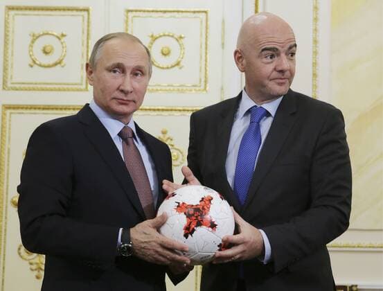 MOSCOW, RUSSIA - NOVEMBER 25, 2016: Russia s President Vladimir Putin (L) and FIFA President Gianni Infantino hold Krasava, the official match ball for the 2017 FIFA Confederations Cup, at a meeting at Moscow s Kremlin. Mikhail Metzel TASS  74882362