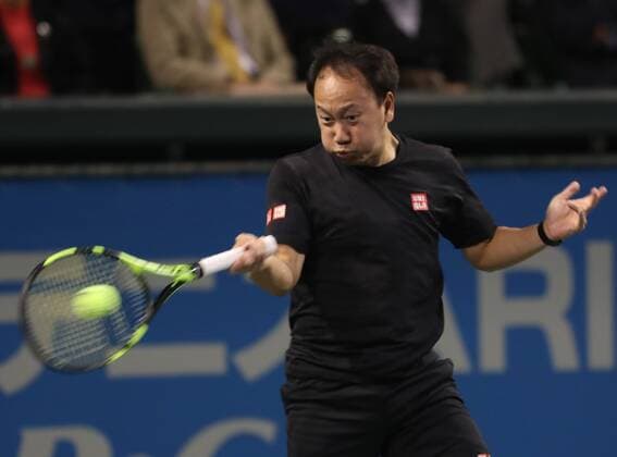 November 26, 2016, Tokyo, Japan - Former French Opens Tennis champion Michael Chang of the United States returns the ball against Japan s Taro Daniel during an annual charity tennis match Dream Tennis Ariake in Tokyo on Saturday, November 26, 2016. Admission money will be donated for the rebuild of tennis facilities at the tsunami affected area in northern Japan. NOxTHIRDxPARTYxSALES.  (lwxa006487)