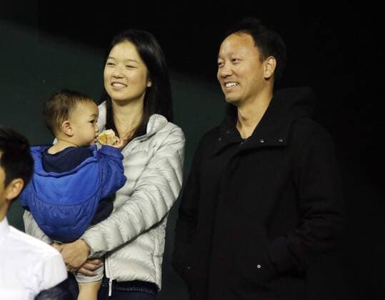 November 26, 2016, Tokyo, Japan - Former French Opens Tennis champion Michael Chang of the United States smiles with his family members during an annual charity tennis match Dream Tennis Ariake in Tokyo on Saturday, November 26, 2016. Admission money will be donated for the rebuild of tennis facilities at the tsunami affected area in northern Japan. NOxTHIRDxPARTYxSALES.  (lwxa006490)