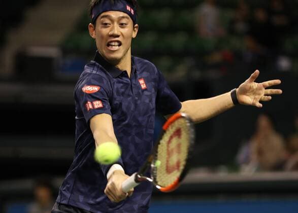 November 26, 2016, Tokyo, Japan - Japan s Kei Nishikori returns the ball against former world number one ranker Andy Roddick of the United States during an annual charity tennis match Dream Tennis Ariake in Tokyo on Saturday, November 26, 2016. Admission money will be donated for the rebuild of tennis facilities at the tsunami affected area in northern Japan. NOxTHIRDxPARTYxSALES.  (lwxa006509)