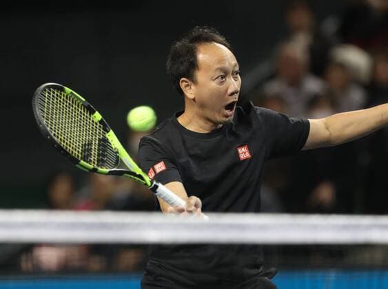 November 26, 2016, Tokyo, Japan - Former French Opens Tennis champion Michael Chang of the United States returns the ball against Japan s Taro Daniel during an annual charity tennis match Dream Tennis Ariake in Tokyo on Saturday, November 26, 2016. Admission money will be donated for the rebuild of tennis facilities at the tsunami affected area in northern Japan. NOxTHIRDxPARTYxSALES.  (lwxa006511)