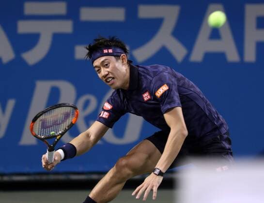 November 26, 2016, Tokyo, Japan - Japan s Kei Nishikori returns the ball against former world number one ranker Andy Roddick of the United States during an annual charity tennis match Dream Tennis Ariake in Tokyo on Saturday, November 26, 2016. Admission money will be donated for the rebuild of tennis facilities at the tsunami affected area in northern Japan. NOxTHIRDxPARTYxSALES.  (lwxa006510)