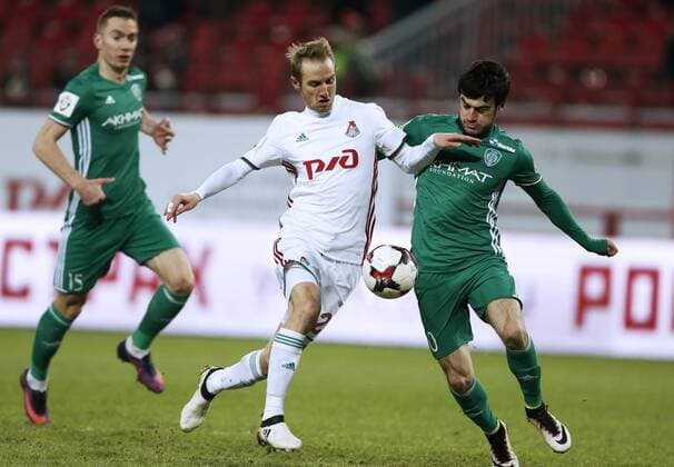 MOSCOW, RUSSIA - DECEMBER 4, 2016: Terek Grozny s Andrei Semyonov (L), Rizvan Utsiyev (R) and Lokomotiv Moscow s Vladislav Ignatyev (C) fight for the ball in their 2016 17 Russian Premier League Round 17 football match at Lokomotiv Stadium. Mikhail Japaridze TASS  TS039DDA