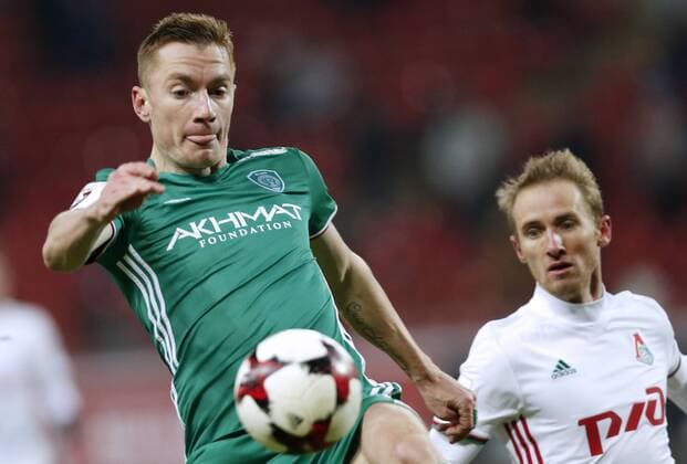 MOSCOW, RUSSIA - DECEMBER 4, 2016: Terek Grozny s Andrei Semyonov (L) and Lokomotiv Moscow s Vladislav Ignatyev fight for the ball in their 2016 17 Russian Premier League Round 17 football match at Lokomotiv Stadium. Mikhail Japaridze TASS  TS039DDF