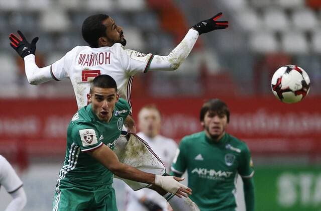 MOSCOW, RUSSIA - DECEMBER 4, 2016: Terek Grozny s Milad Mohammadi (front) and Lokomotiv Moscow s Maicon (white) fight for the ball in their 2016 17 Russian Premier League Round 17 football match at Lokomotiv Stadium. Mikhail Japaridze TASS  TS039E0C