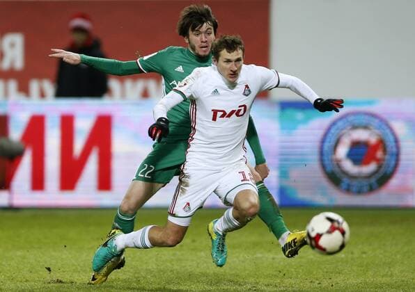 MOSCOW, RUSSIA - DECEMBER 4, 2016: Terek Grozny s Reziuan Mirzov (L) and Lokomotiv Moscow s Alexander Kolomeitsev fight for the ball in their 2016 17 Russian Premier League Round 17 football match at Lokomotiv Stadium. Mikhail Japaridze TASS  TS039E0F