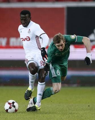 MOSCOW, RUSSIA - DECEMBER 4, 2016: Lokomotiv Moscow s Delvin N Dinga (L) and Terek Grozny s Adilson fight for the ball in their 2016 17 Russian Premier League Round 17 football match at Lokomotiv Stadium. FC Lokomotiv Moscow won the game 2-0. Mikhail Japaridze TASS  TS039E39