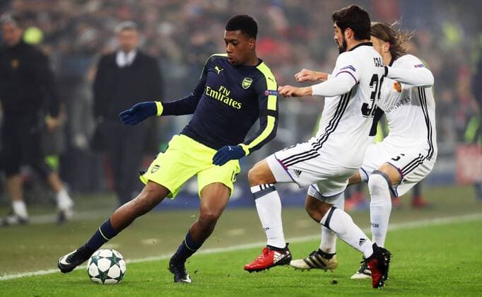 SOCCER - CL, Basel vs Arsenal BASEL,SWITZERLAND,06.DEC.16 - SOCCER - UEFA Champions League, group stage, FC Basel vs Arsenal FC. Image shows Alex Iwobi (Arsenal), Davide Calla and Michael Lang (Basel). GEPAxpictures xMatthiasxHauer