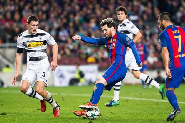 VfL Borussia Monchengladbach s Andreas Christensen, FC Barcelona Barca s Leo Messi during Champions League match between Futbol Club Barcelona and VfL Borussia Mönchengladbach at Camp Nou Stadium in Barcelona , Spain. December 06, 2016.  (20161206085)