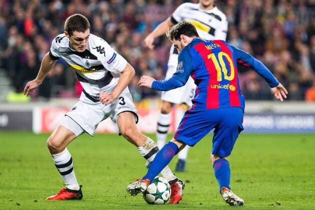 VfL Borussia Monchengladbach s Andreas Christensen, FC Barcelona Barca s Leo Messi during Champions League match between Futbol Club Barcelona and VfL Borussia Mönchengladbach at Camp Nou Stadium in Barcelona , Spain. December 06, 2016.  (20161206087)