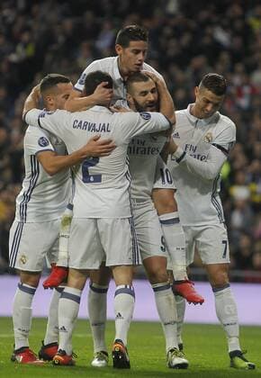 Soccer match between Real Madrid and Borussia Dortmund of the 2016 2017 Champions League, held at the Santiago Bernabeu stadium, in Madrid, December 7, 2016. Photo by J. Luis Cuesta 261 Cordon Press. Players celebrate with Karim Benzema after scoring  xJosexLuisxCuestax xx