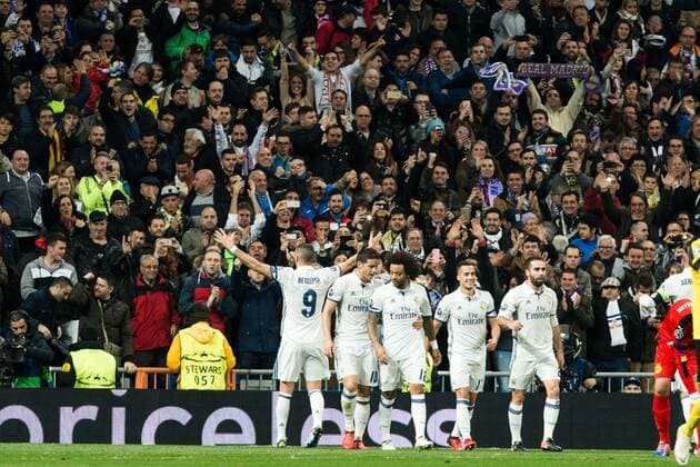 Real Madrid s Marcelo Vieira, Karim Benzema during Champions League match between Real Madrid and Borussia Dortmund at Santiago Bernabeu Stadium in Madrid , Spain. December 07, 2016.  (20161207005)