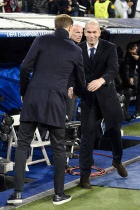 Real Madrid s Coach Zinedine Zidane and Borussia Dortmund coach Thomas Tuchel during the UEFA Champions League match between Real Madrid and Borussia Dortmund at Santiago Bernabeu Stadium in Madrid, Spain. December 07, 2016.  (20161207027)