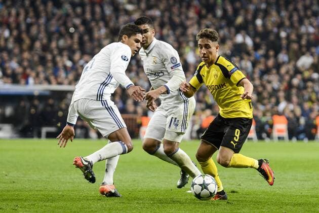 Real Madrid s Raphael Varane and Carlos Henrique Casemiro and Borussia Dortmund Emre Mor during the UEFA Champions League match between Real Madrid and Borussia Dortmund at Santiago Bernabeu Stadium in Madrid, Spain. December 07, 2016.  (20161207042)