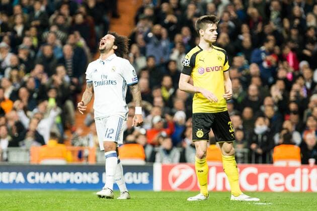 Real Madrid s Marcelo Vieira, Borussia Dortmund Julian during Champions League match between Real Madrid and Borussia Dortmund at Santiago Bernabeu Stadium in Madrid , Spain. December 07, 2016.  (20161207071)
