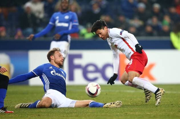 SOCCER - UEFA EL, RBS vs Schalke SALZBURG,AUSTRIA,08.DEC.16 - SOCCER - UEFA Europa League, group stage, Red Bull Salzburg vs FC Schalke 04. Image shows Benedikt Hoewedes (Schalke) and Takumi Minamino (RBS). GEPAxpictures xFelixxRoittner