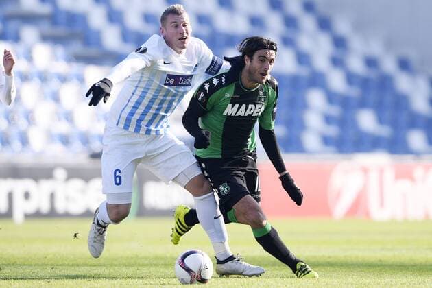Genk s Sebastien Dewaest and Sassuolo s Alessandro Matri fight for the ball during a soccer game between Italian Club U.S. Sassuolo Calcio and Belgian team KRC Genk in Parma, Italy, Friday 09 December 2016, the sixth and last game of the group stage of the Europa League competition, in Group F. The match was scheduled for yesterday, but it was postponed due to heavy fog. YORICKxJANSENS  x04994440x