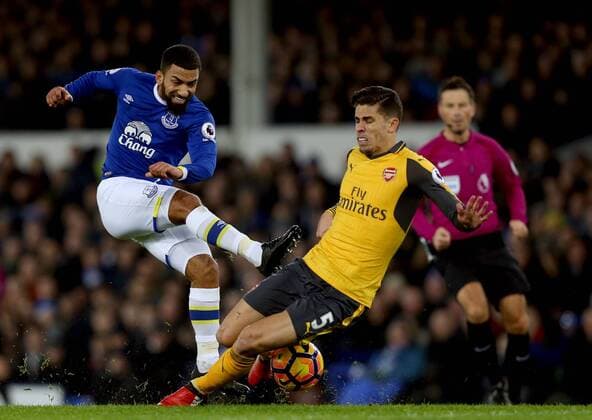 Aaron Lennon of Everton has a shot blocked Gabriel Paulista of Arsenal during the English Premier League match at Goodison Park Stadium, Liverpool. Picture date: December 13th, 2016. Pic Simon Bellis Sportimage EDITORIAL USE ONLY. No use with unauthorised audio, video, data, fixture lists, club league logos or live services. Online in-match use limited to 120 images, no video emulation. No use in betting, games or single club league player publications.