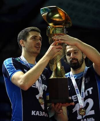 SURGUT, RUSSIA - DECEMBER 17, 2016: Zenit-Kazan s Matthew Anderson (L) and Alexander Butko hold the trophy during an award ceremony for the 2016 Russia Volleyball Cup Final match against Lokomotiv Novosibirsk. Zenit-Kazan won the game 3-1. Roman Kruchinin TASS  TS03B80C