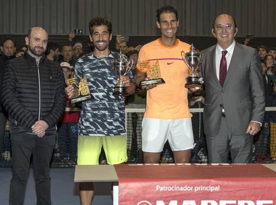 Spanish tennis players Rafa Nadal (2R) and Marc Lopez (2L) pose with the trophy after winning the Spain s Absolute Tennis Championship doubles final against Jordi Munoz and David Perez in Manacor, Balearic Islands, Spain, 17 December 2016. EFE Cati Caldera RAFA NADAL AND MARC LOPEZ PLAY THE DOUBLES FINAL AT SPAIN S ABSOLUTE TENNIS CHAMPIONSHIP IN MANACOR !ACHTUNG: NUR REDAKTIONELLE NUTZUNG!  BAL001 20161217-636176042588072209