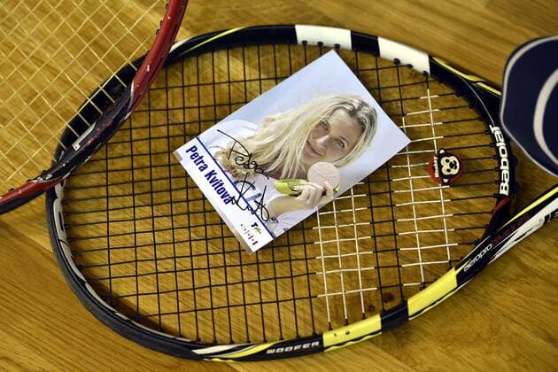A photograph of Czech tennis player Petra Kvitova is seen laid on a tennis racket during charity tennis exhibition in Brno on Tuesday, Dec. 20, 2016. Two-time Wimbledon champion Petra Kvitova had to cancel her participation in the event because of injuring during an attack in her flat in Prostejov, the Czech Republic. Kvitova s spokesman Karel Tejkal says Tuesday Dec. 20, 2016 Kvitova suffered a left hand injury and has been treated by doctors. (CTKxPhoto VaclavxSalek) CTKPhotoP201612200515001  sal 15