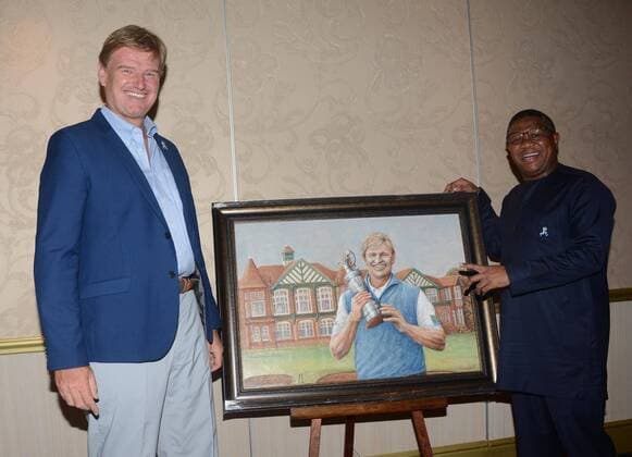 The 2017 BMW SA Open Championship gala dinner KEMPTON PARK, SOUTH AFRICA - JANUARY 10: and Recreation Minister Fikile Mbalula and South African golfer Ernie Els pose with a painting portraying Els during the 2017 BMW SA Open Championship gala dinner at Emperors Palace on January 10, 2017 in Kempton Park, South Africa. The BMW SA Open hosted by City of Ekurhuleni, which starts on January 12, 2017 will be held at the picturesque Glendower Golf Club, with Rory McIlroy, Ernie Els, Brandon Stone and Andy Sullivan in the field. ( Gallo0108223
