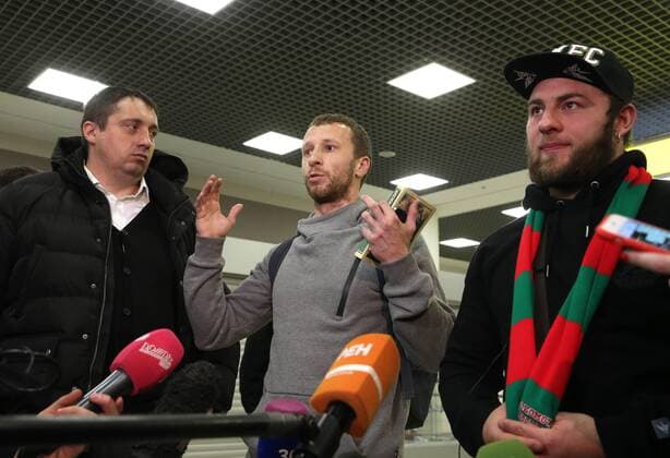 MOSCOW REGION, RUSSIA - JANUARY 18, 2017: Alexander Shprygin (L), head of the All Russian Union of Supporters, and Sergei Gorbachev (C) and Alexei Yerunov, two Russian football fans who were sentenced to prison temrs in France over clashes with England fans in Marseilles at the 2016 UEFA European Championship EM Europameisterschaft talk to reporters as Yerunov and Gorbachev arrive at Sheremetyevo Airport. Vladimir Gerdo TASS  76339714st