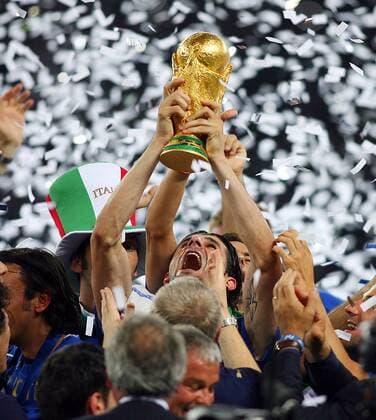 July 9, 2006 - Olympiastadion, BERLIN, GERMANY - Andrea Pirlo lifts wortd cup...ITALY V FRANCE..Andrea Pirlo lifts wortd cup.ITALY V FRANCE.OLYMPIC STADIUM, BERLIN GERMANY 07-09-2006.K48556. - PHOTOS ITALY VS FRANCE ALL - ZUMAg49_ 76421919st