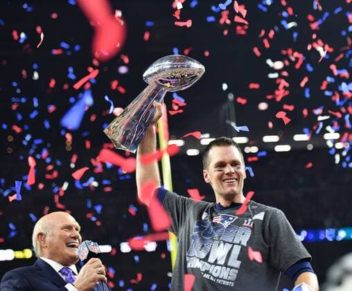 New England Patriots quarterback Tom Brady lifts the Vince Lombardi Trophy after defeating the Atlanta Falcons in Super Bowl LI at NRG Stadium in Houston on February 5, 2017. The Patriots came from behind to defeat the Falcons 34-28 in overtime.  SBP20170205497 KEVINxDIETSCH