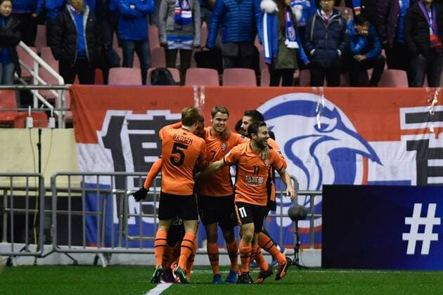 SHANGHAI, CHINA - FEBRUARY 08: Brandon Borrello 28 of Brisbane Roar celebrates with team mates after scoring his team s first goal during the AFC Champions League 2017 play-off match between Shanghai Shenhua and Brisbane Roar at Hongkou Stadium on February 8, 2017 in Shanghai, China.  Copyright: xVCGx CFP499553055 