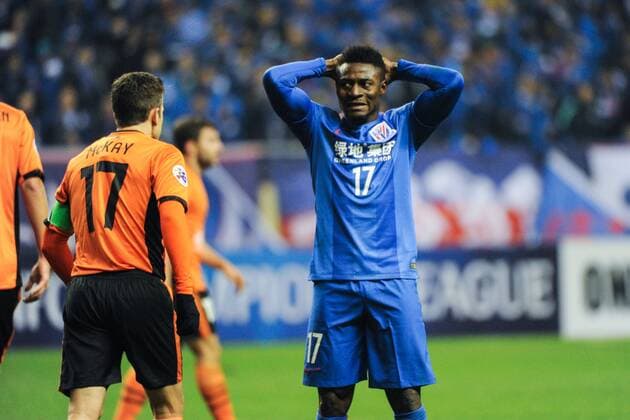 Obafemi Martins of China s Shanghai Greenland Shenhua F.C., right, reacts after missing a goal against Australia s Brisbane Roar F.C. in a qualifying match during the 2017 AFC Champions League in Shanghai, China, 8 February 2017. Carlos Tevez s debut for big-spending Chinese Super League side Shanghai Shenhua did not go as planned. In fact, it was the exact opposite as they were unceremoniously dumped out of the Asian Champions League play-off by Brisbane Road. Tevez, who moved to China from Boca Juniors for a reported ¡ê615,000-a-week and became the world s highest-paid player , couldn t help his new team-mates as they went down 2-0 in one of the biggest shocks the AFC has seen. Carlos Tevez has nightmare debut for Shanghai Shenhua as they are dumped out of AFC Champions League  20170208_36065