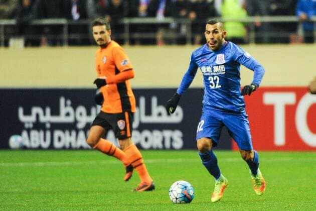 Argentine football player Carlos Tevez of China s Shanghai Greenland Shenhua F.C., right, dribbles against Australia s Brisbane Roar F.C. in a qualifying match during the 2017 AFC Champions League in Shanghai, China, 8 February 2017. Carlos Tevez s debut for big-spending Chinese Super League side Shanghai Shenhua did not go as planned. In fact, it was the exact opposite as they were unceremoniously dumped out of the Asian Champions League play-off by Brisbane Road. Tevez, who moved to China from Boca Juniors for a reported ¡ê615,000-a-week and became the world s highest-paid player , couldn t help his new team-mates as they went down 2-0 in one of the biggest shocks the AFC has seen. Carlos Tevez has nightmare debut for Shanghai Shenhua as they are dumped out of AFC Champions League  20170208_12402