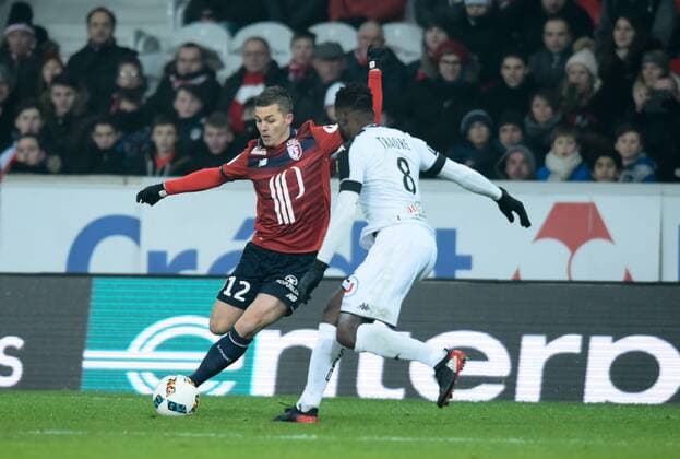 Nicolas De Preville ( Lille ) - Ismael Traore ( Angers ) FOOTBALL : Lille OSC vs SCO Angers - Ligue 1 - Lille - 11 02 2017 FedericoPestellini Panoramic 