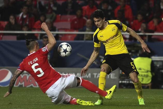 February 14, 2017 - Lisbon, Portugal - Benfica s Serbian midfielder Ljubomir Fejsa (L) makes a penalty next to Dortmund s defender Bartra during the Champions League football match between SL Benfica and Borussia Dortmund at Luz Stadium in Lisbon on February 14, 2017. SL Benfica v Borussia Dortmund - UEFA Champions League Round of 16: First Leg  - ZUMAn230 20170214_zaa_n230_494 Copyright: xCarlosxCostax