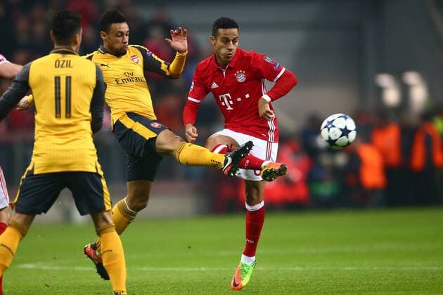 SOCCER - CL, Bayern vs Arsenal MUNICH,GERMANY,15.FEB.17 - SOCCER - UEFA Champions League, FC Bayern Muenchen vs FC Arsenal. Image shows Francis Coquelin (Arsenal) and Thiago Alcantara (Bayern). GEPAxpictures xFelixxRoittner