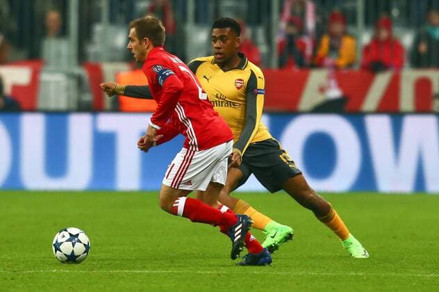 SOCCER - CL, Bayern vs Arsenal MUNICH,GERMANY,15.FEB.17 - SOCCER - UEFA Champions League, FC Bayern Muenchen vs FC Arsenal. Image shows Philipp Lahm (Bayern) and Alex Iwobi (Arsenal). GEPAxpictures xFelixxRoittner