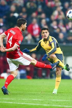 SOCCER - CL, Bayern vs Arsenal MUNICH,GERMANY,15.FEB.17 - SOCCER - UEFA Champions League, FC Bayern Muenchen vs FC Arsenal. Image shows Alexis Sanchez (Arsenal) and Xabi Alonso (Bayern). GEPAxpictures xFelixxRoittner