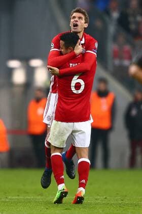 SOCCER - CL, Bayern vs Arsenal MUNICH,GERMANY,15.FEB.17 - SOCCER - UEFA Champions League, FC Bayern Muenchen vs FC Arsenal. Image shows the rejoicing of Thomas Mueller and Thiago Alcantara (Bayern). GEPAxpictures xFelixxRoittner