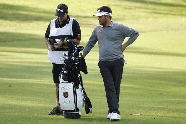 February 16th 2017, Lake Karrinyup Country Club, Perth, Western Australia, Australia; ISPS Handa World Super 6 Perth Golf Tournament Day 1; Louis Oosthuizen (RSA) checks his distance with his caddy for his second shot on the 11th fairway during the first round of the ISPS Handa World Super 6 Golf Tournament; xDavidxWoodleyx  ActionPlus11846788