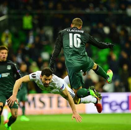UEFA Europa League match between Krasnodar and Fenerbahce at Krasnodar Stadium in Krasnodar , Russia on February 16 , 2017. Pictured: Sener Ozbayrakli of Fenerbahce and Viktor Claesson of Krasnodar. 
