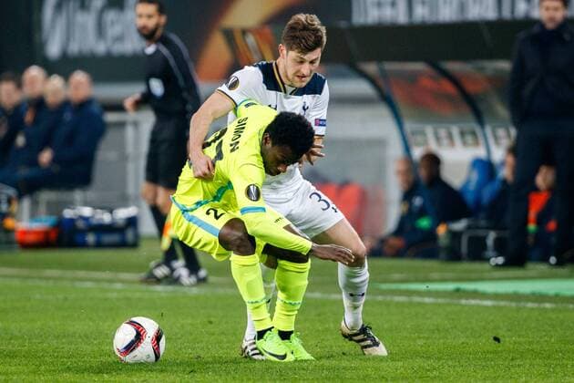 Tottenham s defender Ben Davies and Gent s Moses Simon fight for the ball during a game between Belgian soccer team KAA Gent and British team Tottenham, first-leg of the 1 16 finals of the Europa League competition, Thursday 16 February 2017, in Gent. KURTxDESPLENTER  x05048755x